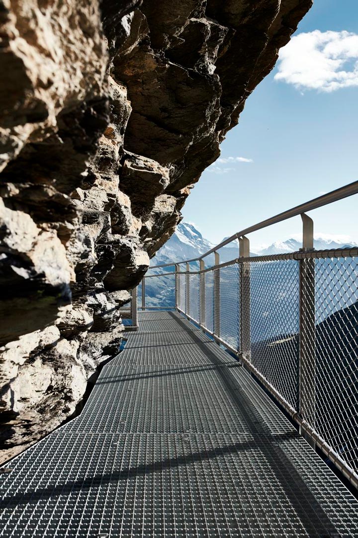 Rock hanging over a bridge secured with Jakob Webnet in Grindelwald