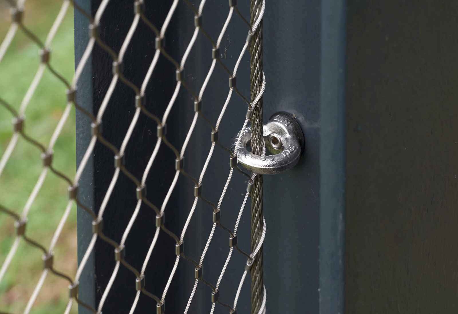 A steel ring on a post holding stainless steel mesh
