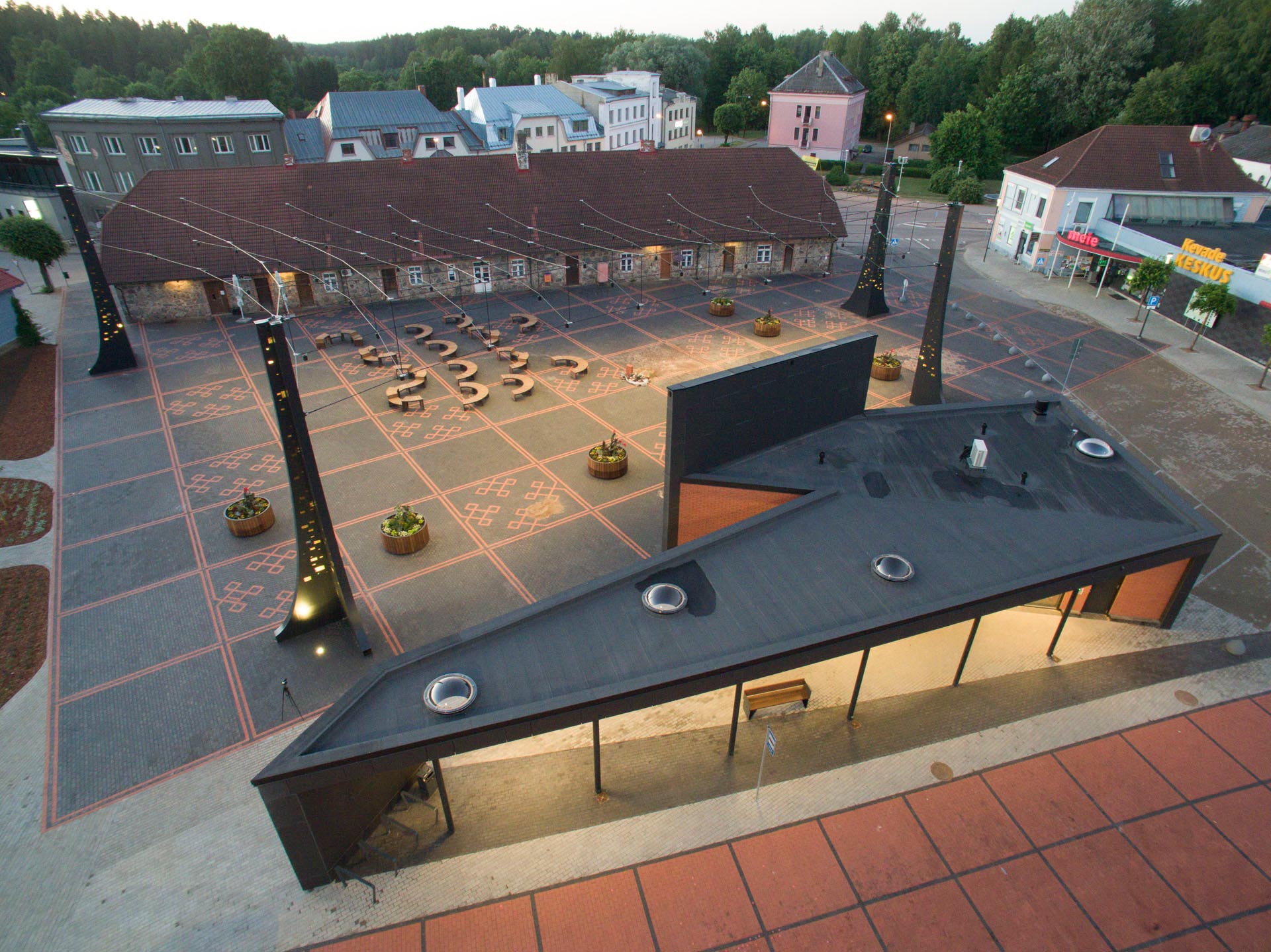 View of Torva centre square from the side at dusk with illumination