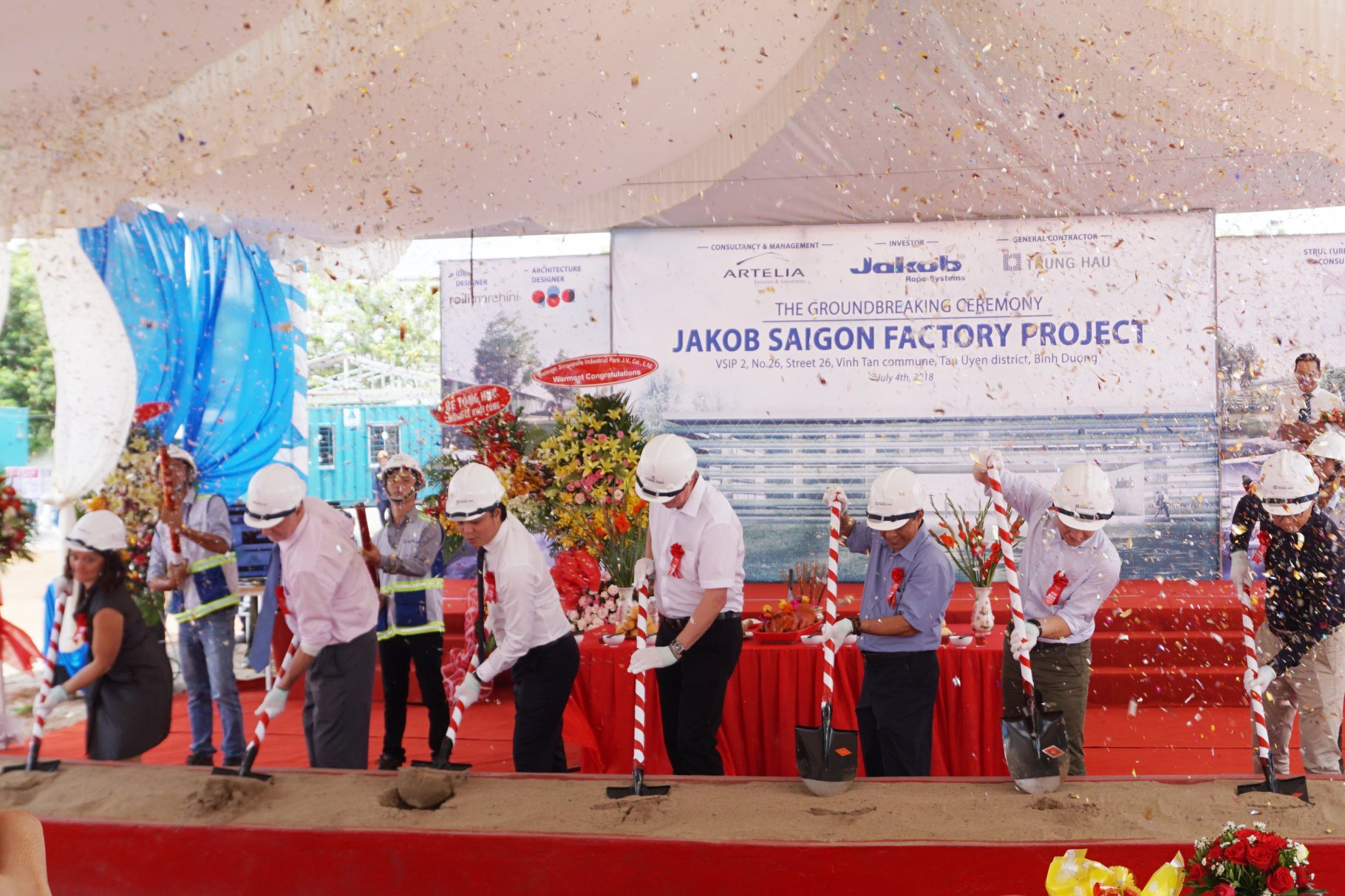 People on stage at the symbolic groundbreaking ceremony of Jakob Saigon in the VSIP II business park